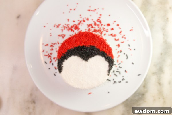 Tuxedo Treat 11 Applying red sprinkles to cupcake for penguin hat