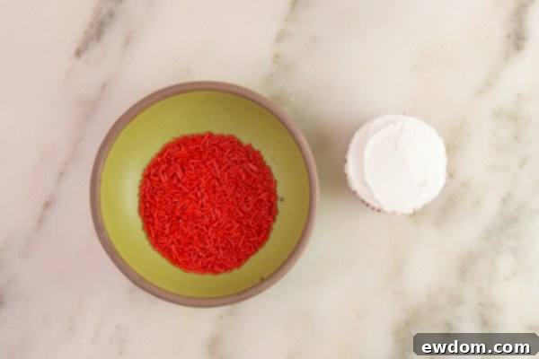 Tuxedo Treat 12 Cupcake hat with red sprinkles