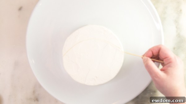 Tuxedo Treat 7 Drawing hat outline on penguin cake