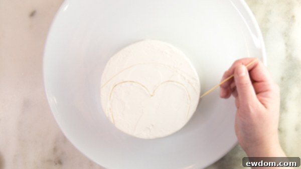 Tuxedo Treat 8 Drawing penguin face outline on cake