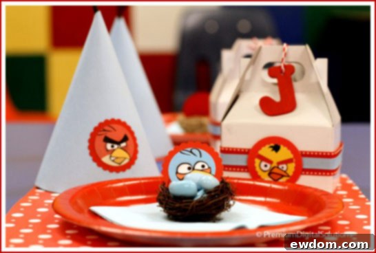 Vibrant Angry Birds Birthday Party table setup with themed decorations and treats
