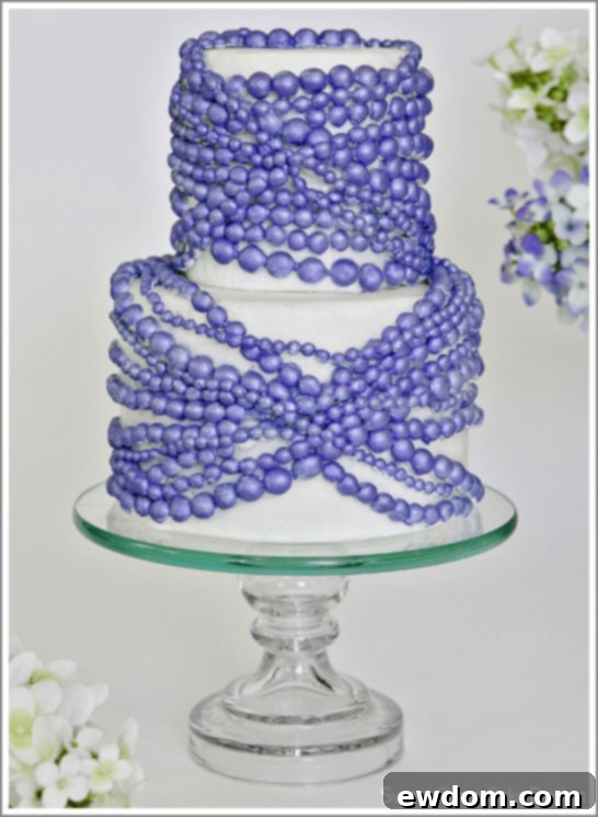 Bold Sapphire Pearl Cake by Sweet Grace Cake Design featuring vibrant blue and pearls