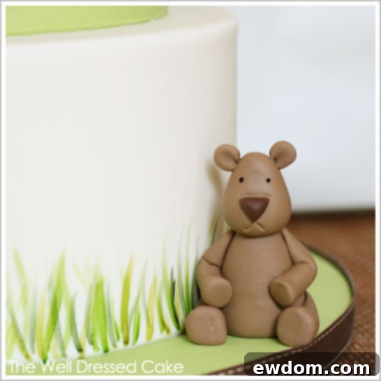 Another view of the Woodland Baby Shower Cake featuring the charming fondant bear topper
