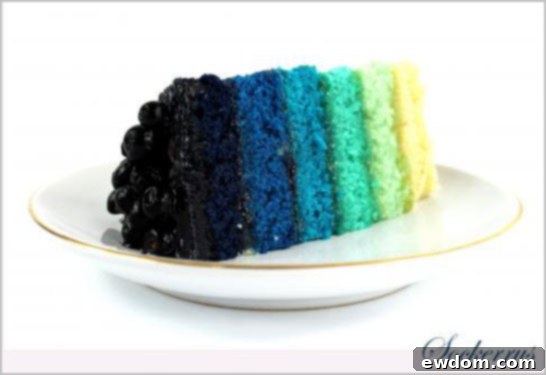 Detailed view of the ombre blue layers of the Rainbow Cake with lemon curd between them