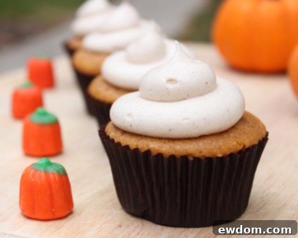 Spiced Pumpkin Delights 6 Delicious pumpkin cupcake close-up, topped with cinnamon cream cheese frosting